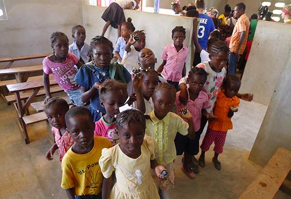 Children enjoy a snack in one of the new classrooms at Flower of Hope.